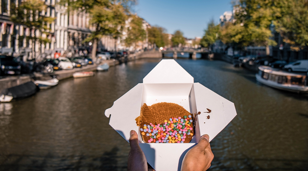 Woman's hand with Stroopwafel in Amsterdam